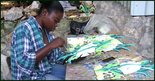 Haitian artist - Painting tropical metal art - Haitian steel drum art. - www.tropicdecor.com.